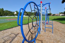 Closeup of the North Bay Park play equipment showing the web climbing structure.